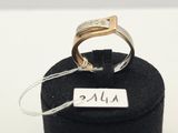 an image of a gold ring with a diamond on it