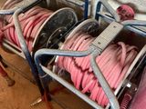 a box with a bunch of pink hoses in it