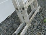 a metal ladder that is sitting on the ground