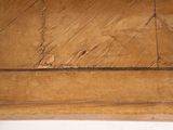 a close up of a wooden table with a white background