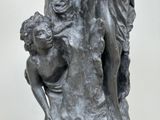 a statue of a woman holding a child in her lap