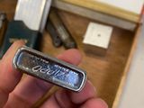 a person holding a silver bar in their hand