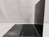 an open laptop computer sitting on top of a white table