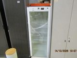 an image of a refrigerator in a store with its door open
