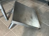 a metal triangle on the floor in the kitchen