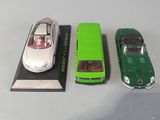 three toy cars that are sitting next to each other