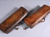two pieces of luggage that are sitting on a table