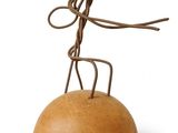 wooden sculpture of a man on a rock with a rope around his neck