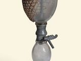 a glass vase with a rope on top of it