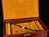 an image of a wooden box with a set of items in it