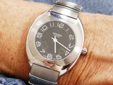 a person wearing a watch on their wrist