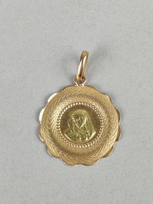 a gold coin with a woman in the center of it