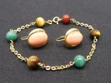 an image of a bracelet and earring set with multi colored beads
