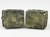 pair of antique bronze bookends with chinese writing on them