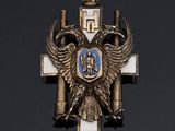 an image of a cross with a coat of arms and a crown on it