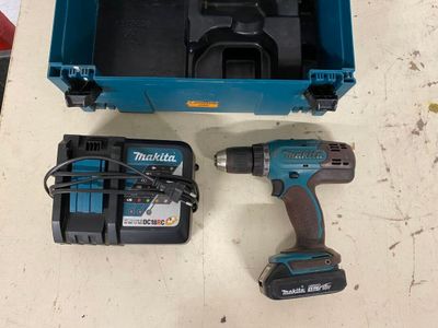 a blue box with a drill and a blue case