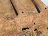 a rusted metal object that is sitting on a table