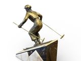 statue of a man on skis on top of a box