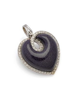 a close up of a heart shaped pendant on a white background