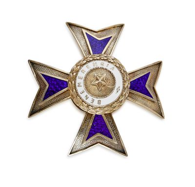 une image représentant une croix violette et dorée surmontée d'une étoile