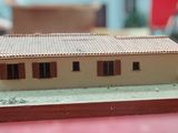 a model of a house on a table in a room