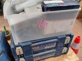 a blue tool box sitting on top of a workbench