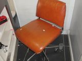 a chair that is sitting in the corner of a room