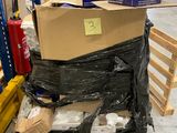 a large stack of boxes on a pallet in a warehouse