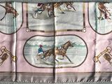 a picture of a scarf with a picture of horses and jockeys on it