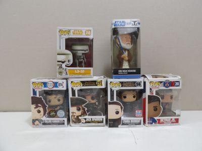a lot of different pop vinyl figures on the table