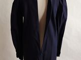 an image of a coat on a mannequin stand