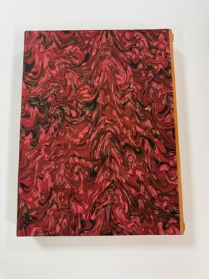 an image of a red and black painting on a white surface