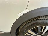 a close up of a car tire with a sticker on it
