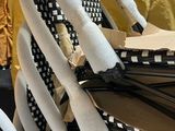a lot of chairs that are stacked on top of each other