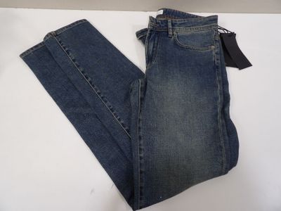 a pair of blue jeans sitting on top of a white table