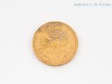 an image of a gold coin sitting on top of a white surface