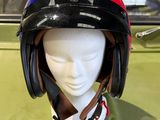 a helmet on a mannequin head on a table