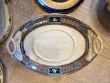 a lot of plates that are sitting on a table