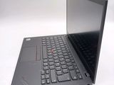 a laptop with a black keyboard sitting on a white surface