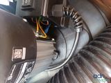 an image of a close up of a blower motor and a hose