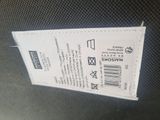 a close up of a ticket on a chair