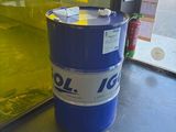 a blue barrel sitting on the floor in front of a window