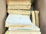 a box full of books sitting on top of a table