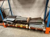 a lot of metal items on a pallet in a warehouse