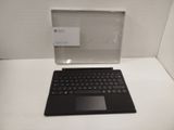 a black laptop computer sitting on top of a white table