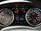 a close up of a car dashboard with a speedometer and gauges