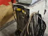a machine that is sitting on the ground in the garage