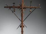 an image of a wooden cross with a bunch of birds perched on it