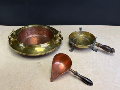 three different types of brass items on a table