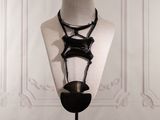 a mannequin with a necklace on it on a stand